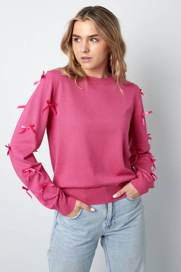 Trui strikjes roze