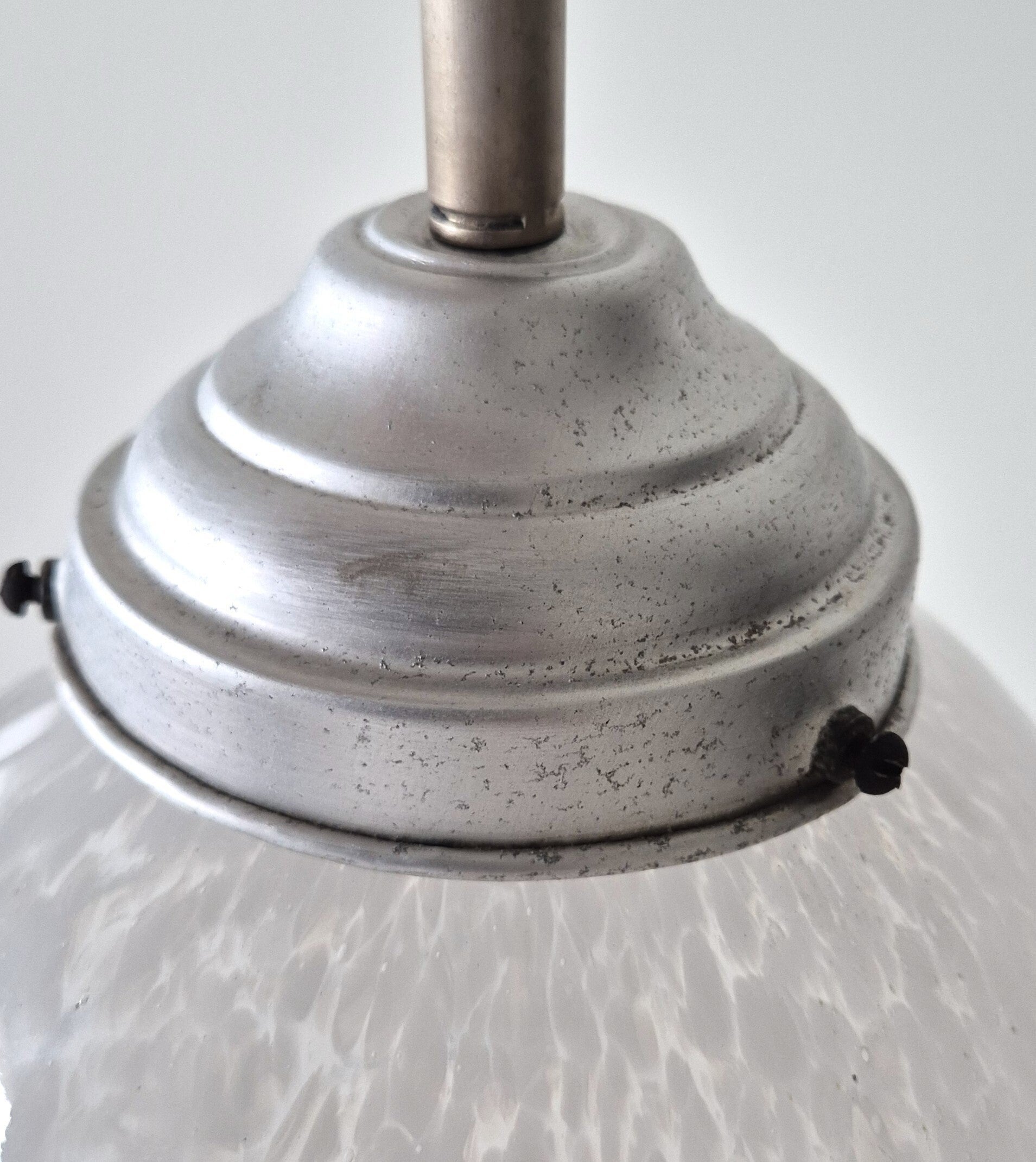 Vintage glass pendant lamp with a soft, diffused glow Retro pendant lamp with an original mid-century design Vintage metal pendant lamp with an industrial finish