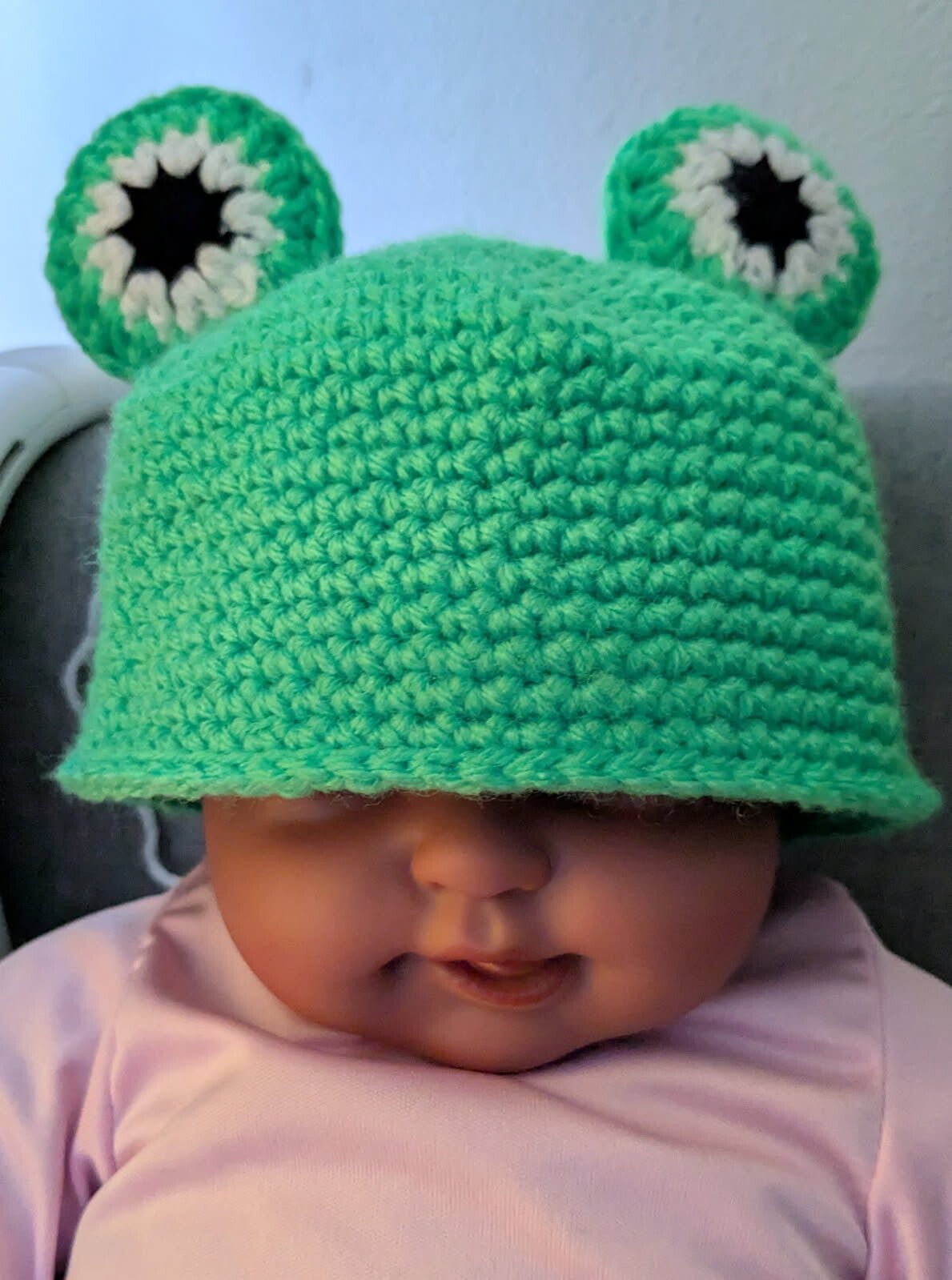 Green crochet baby hat