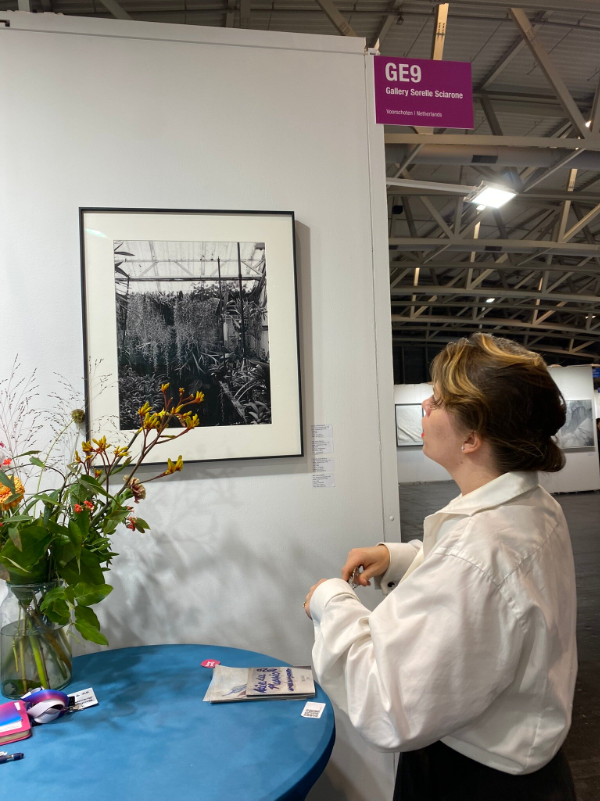 Tascha Sciarone looking at a photograph made by her sister Nicole Sciarone. Tascha is an Art Historian and Nicole is an Artist, Art Talk Moderator and Art Theorist