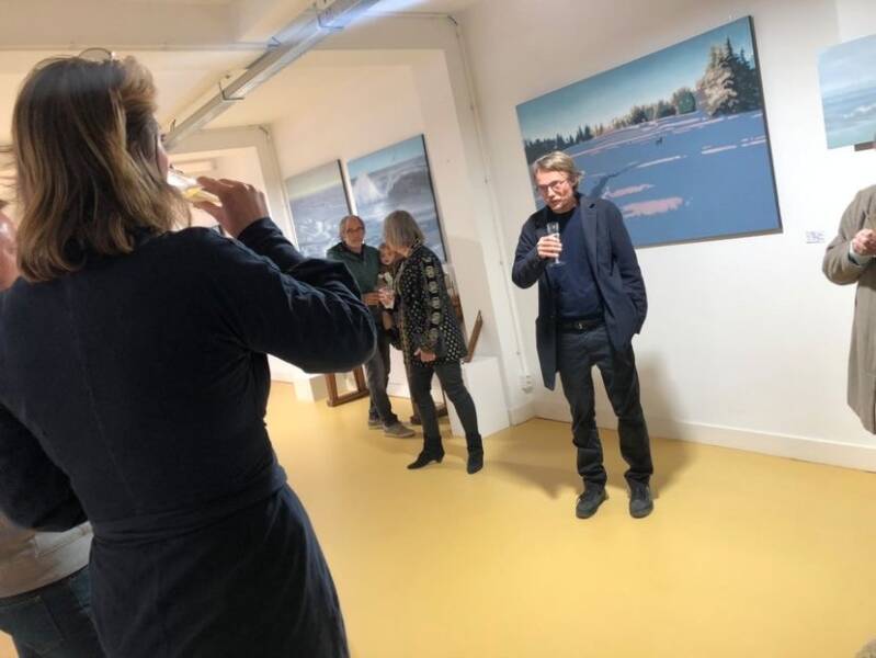 Exhibition: Perseverance by Art Historian Laura Caseberry  Left Behind XII' (2020). Marko Klomp. Oil on Linen. 100 cm x 120cm. On the far left of the photo. Photo of artist Marko Klomp at his solo exhibition in 2022.