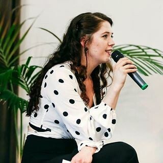 Nicole Sciarone moderating an artist panel in 2017