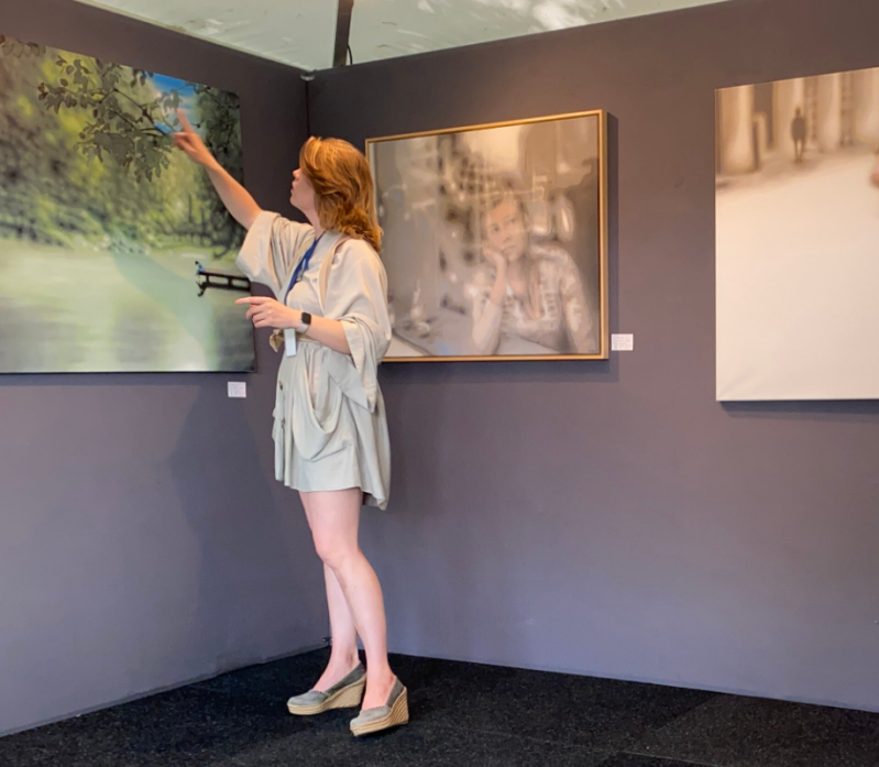 Art Historian Tascha Sciarone at ARt Laren showin g paintings by contemporary artist Marko Klomp. 