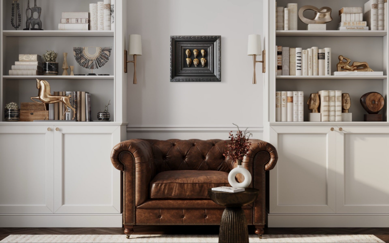 Black and Bold (2023). Negar Rashidi. Mixed Media. 45cm x 50cm (framed). In a white room with a brown chesterfield chair.