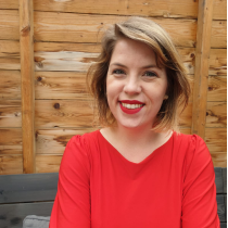 Smiling Art Historian Tascha Sciarone in a red dress