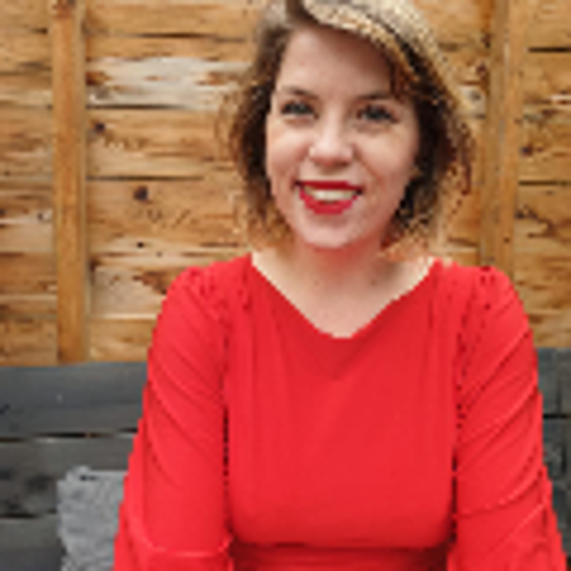 Smiling Art Historian Tascha Sciarone in a red dress