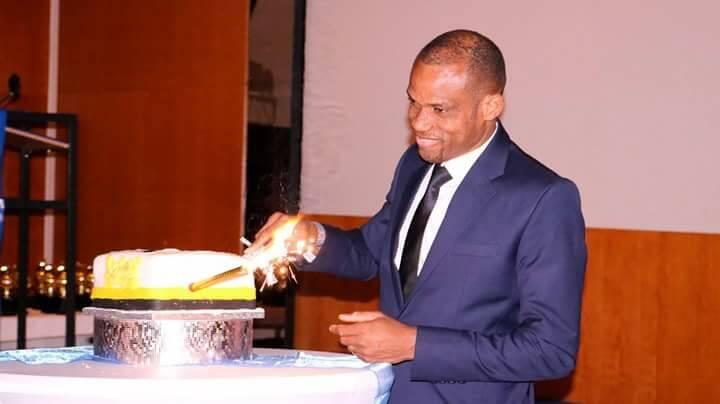 Sunday Oliseh cutting event cake.