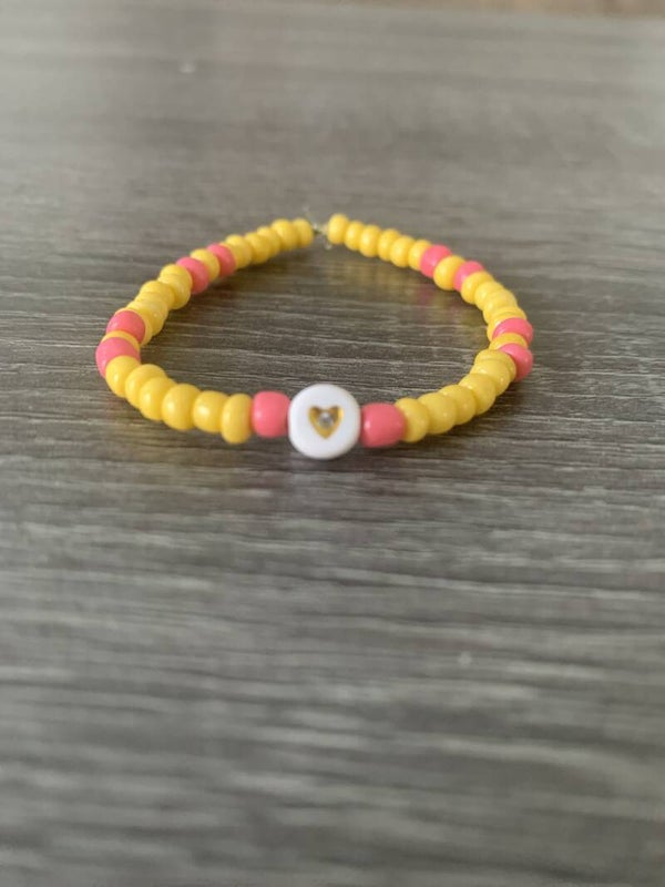 Armband geel met roze