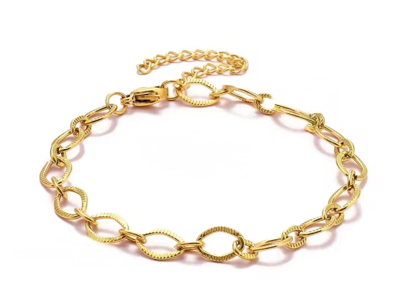 armband ribbel schakel grof goud