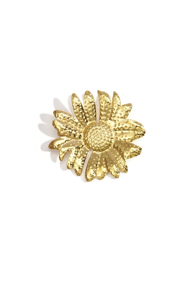 Bloemvorm met stippenmotief broche Goud