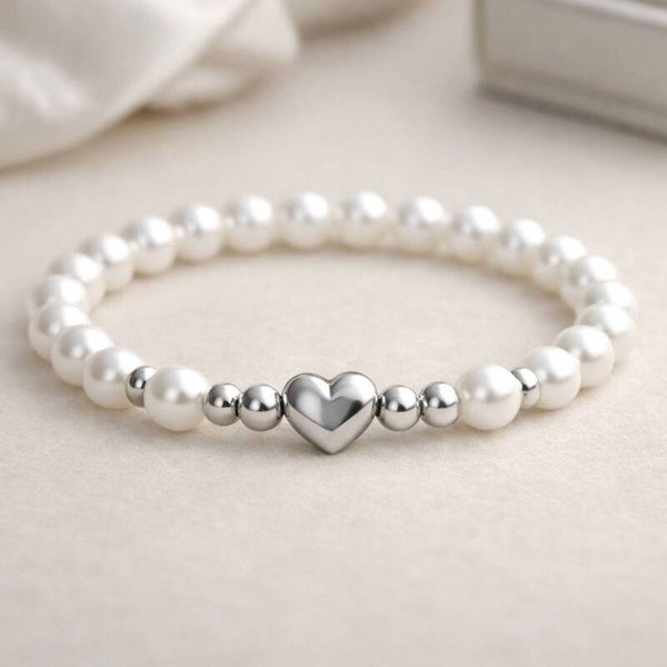 Elegancka bransoletka z perłami i srebrnym sercem