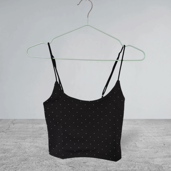 Top brillante con bretelline