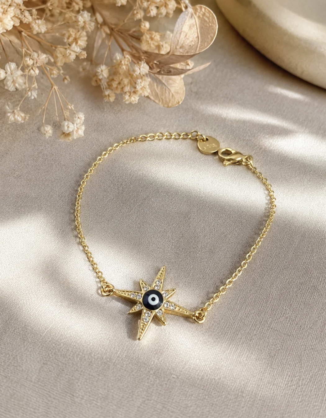 Bracelet doré étoile et œil