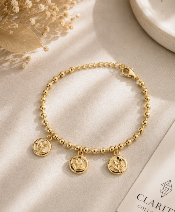 Bracelet doré médaillons fleurs