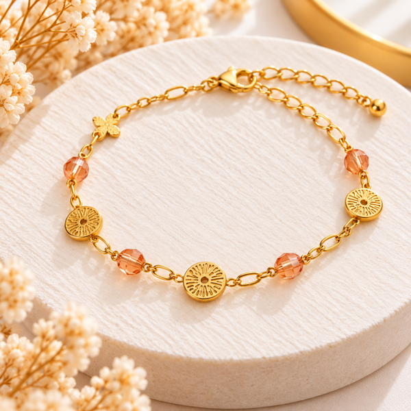 Bracelet doré motifs soleil et perles pêche
