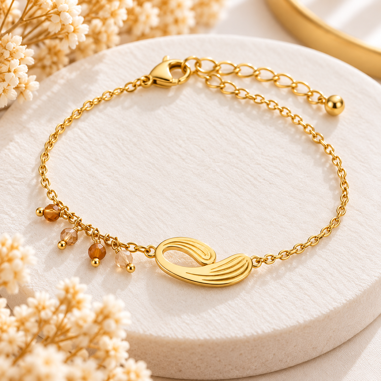 Bracelet doré motif feuille et perles champagne