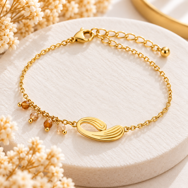 Bracelet doré motif feuille et perles champagne