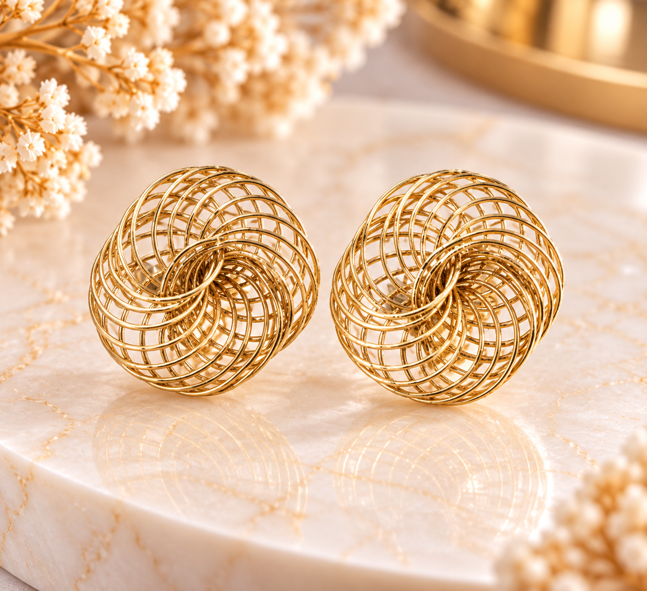 Boucles d’oreilles spirales dorées ajourées – Acier inoxydable