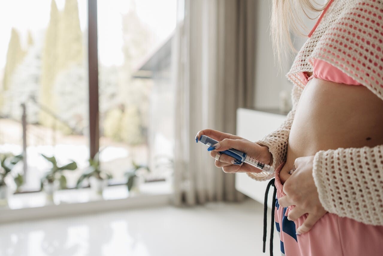 woman injecting peptides