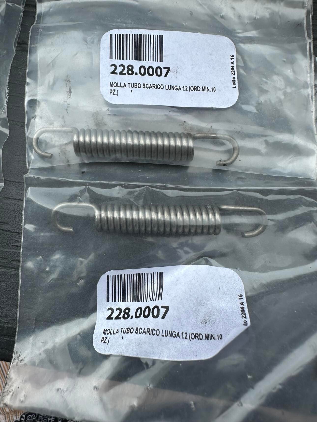 228.0007 exhaust silencer spring, length 68.5 mm