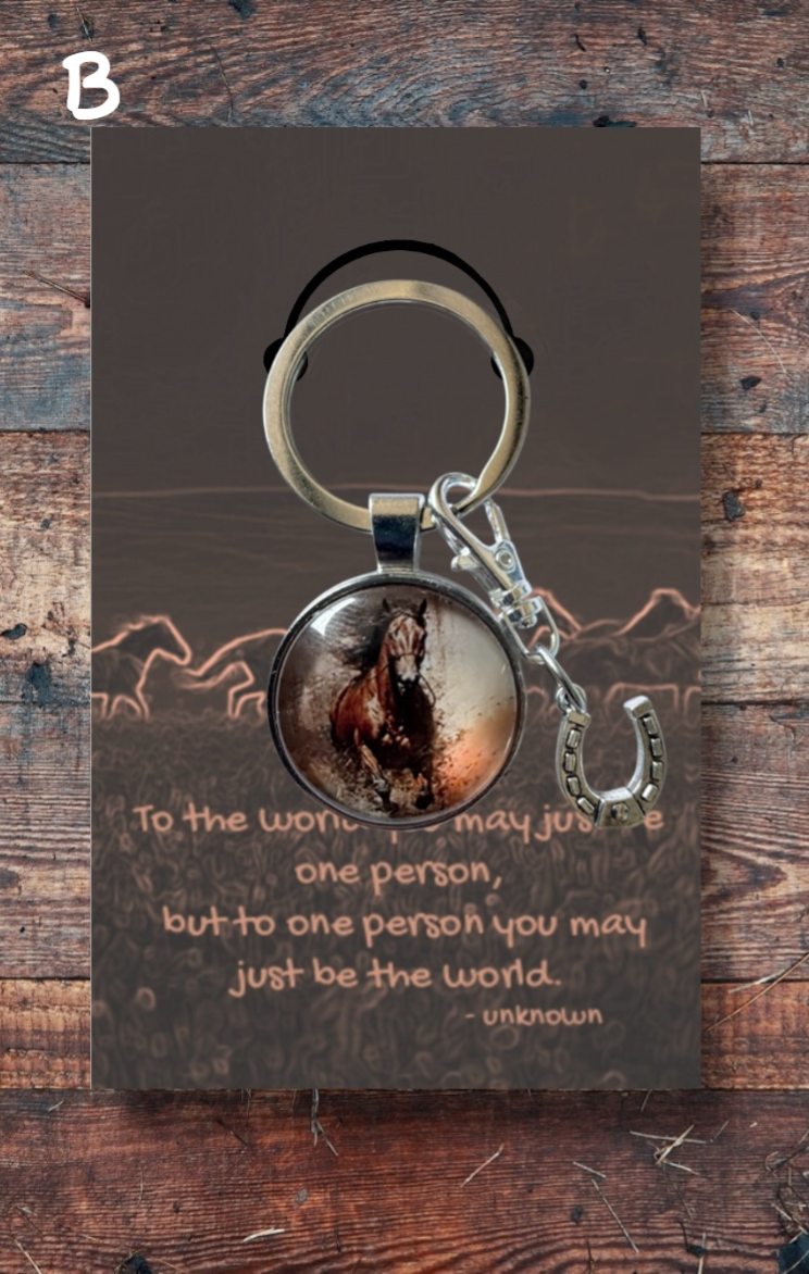 Bay horse running, with silver horseshoe charm