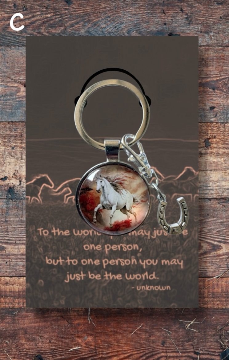 White horse running with silver horseshoe charm