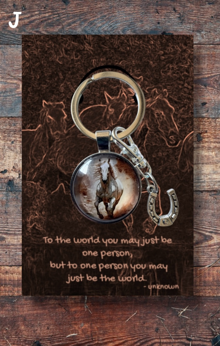 Grey horse running, with silver horseshoe charm brown card