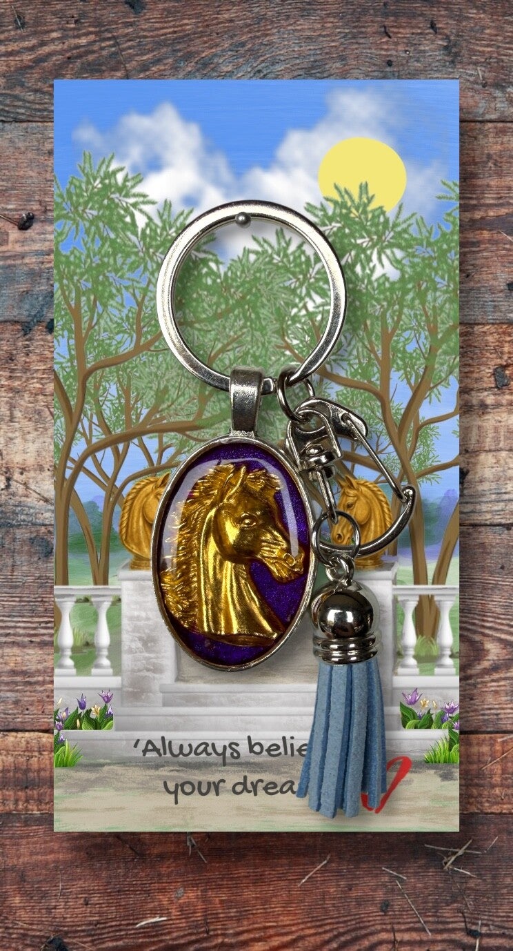 Golden horse head on silver key chain with clip and tassel