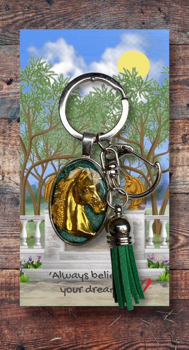 Golden horse head on silver key chain with clip and tassel