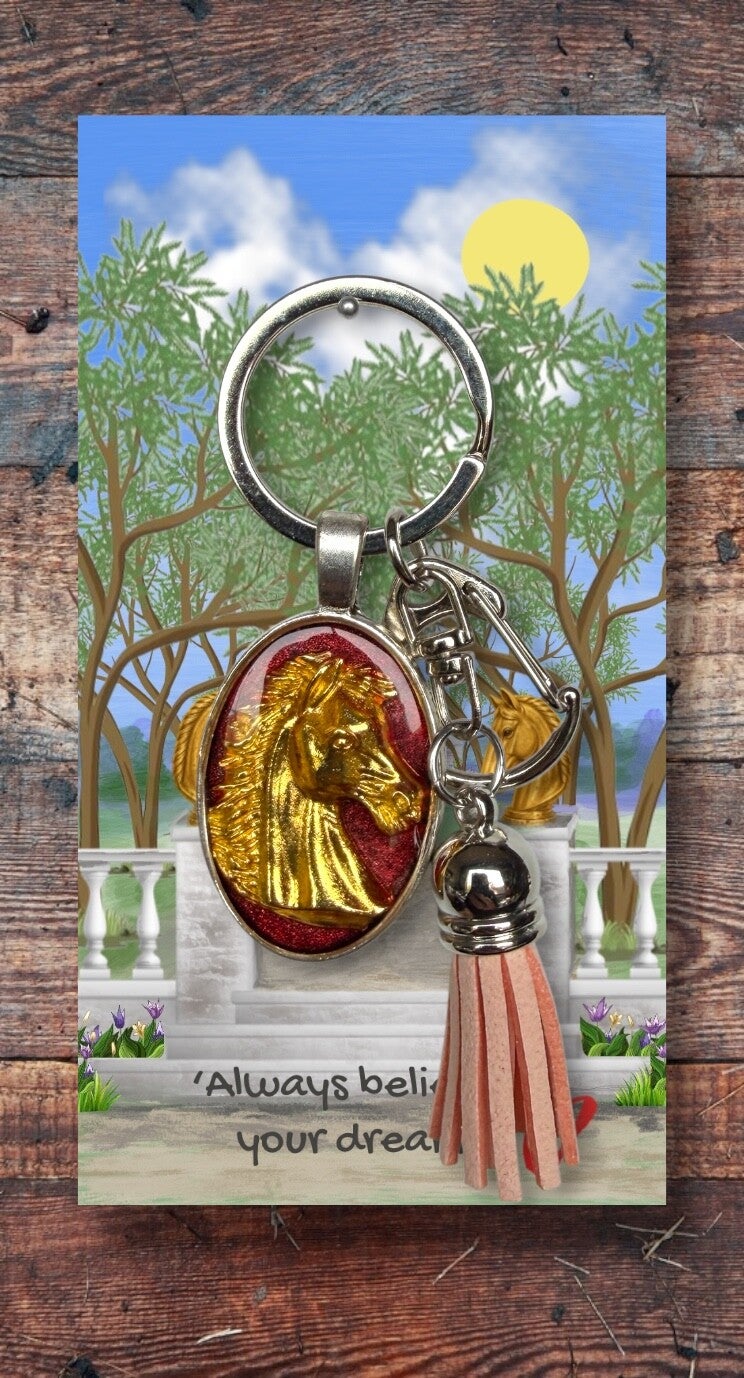 Golden horse head on silver key chain with clip and tassel
