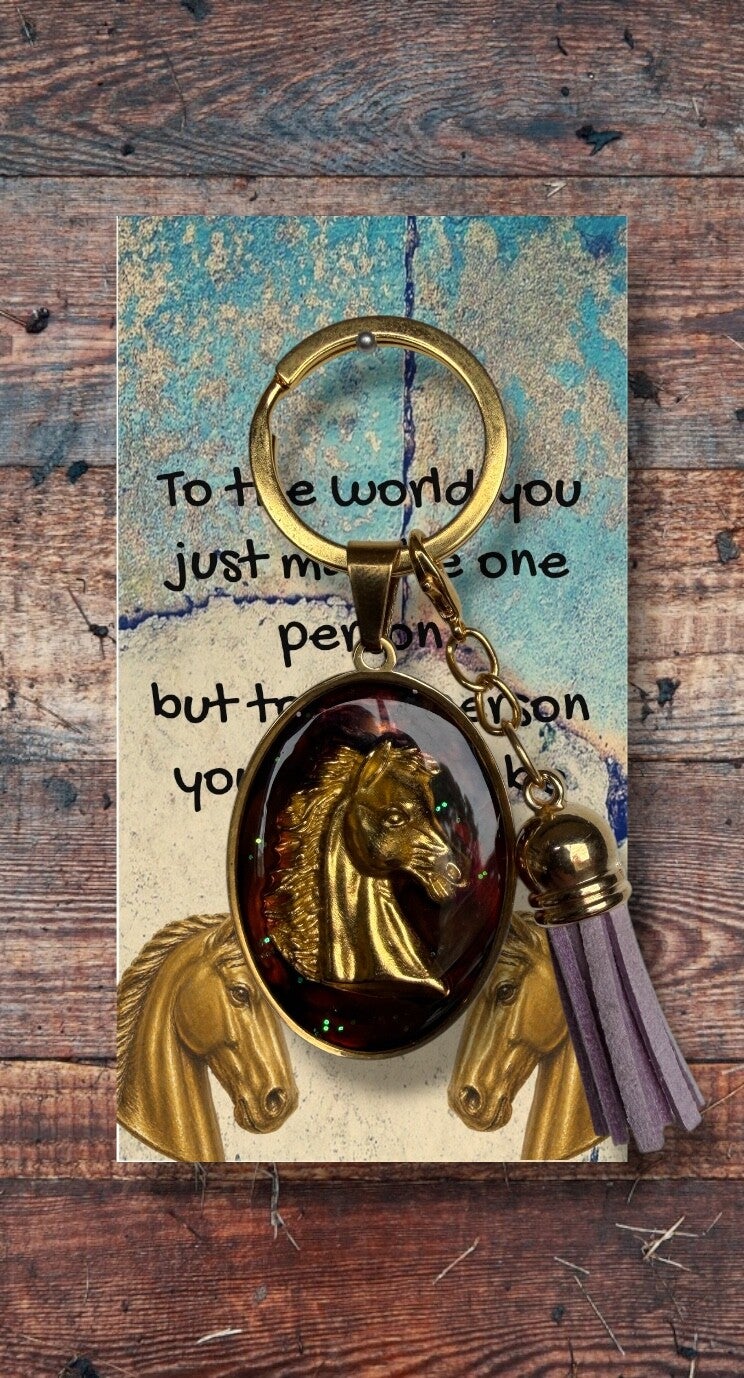 Golden horse head with coloured tassel