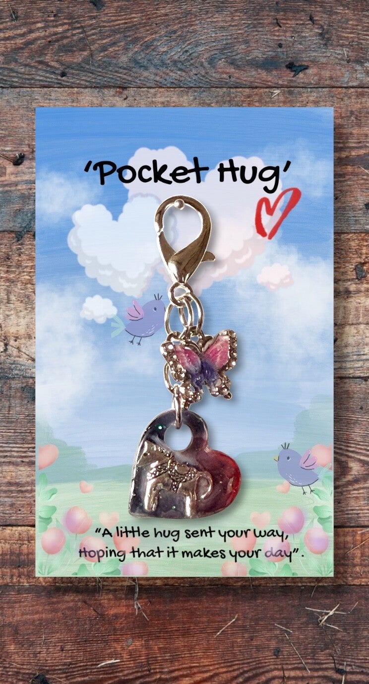Tiny silver horse in a heart hug