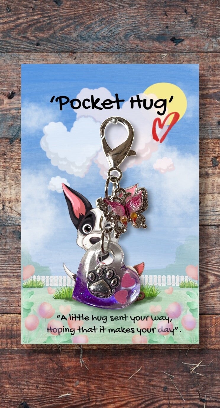 Silver paw in a heart hug with butterfly