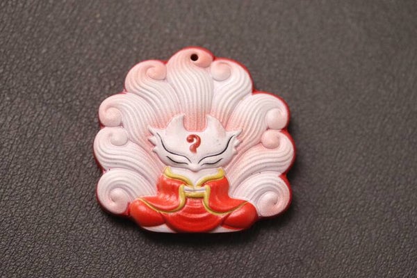 Nine tailed fox / negenstaartenvos hanger van cinnaber