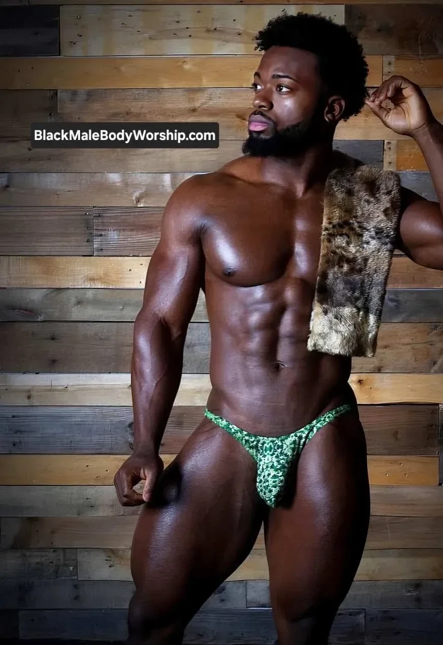 Confident Black man displaying full-body presence, radiating self-respect, sensual control, and Black male body reverence.