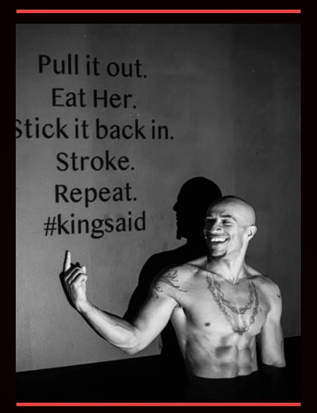 king noire adult star shirtless pointing in front of a wall with suggestive text: "Pull it out. Eat Her. Stick it back in. Stroke. Repeat. #kingsaid