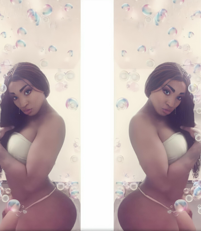 Sexy black transgender BDSM, kink, and fetish educator for black men and lgbtqi modeling alluring swim suit and exuding confidence.