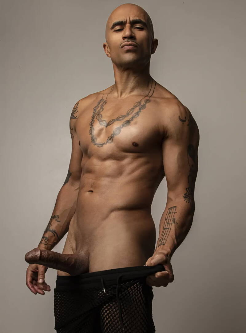 King Noire side profile with sexual expression on his face showing off errect penis for Kink Training Top Black Male Pornstar in 2025 Bio 