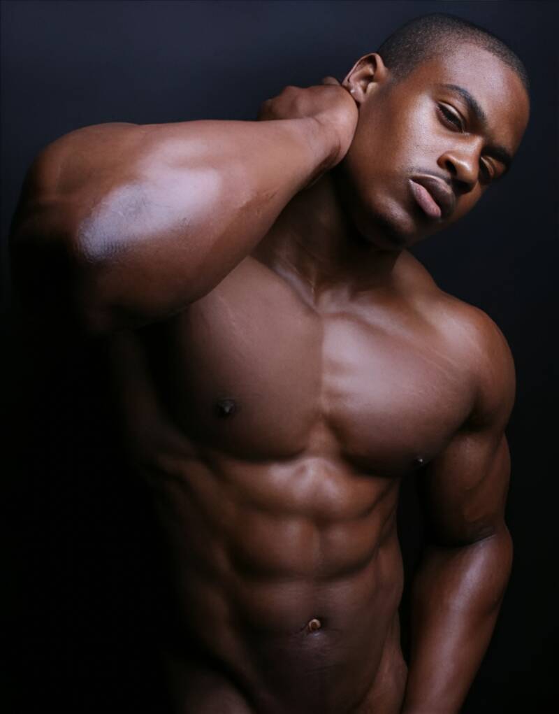 Simeon panda an attractive, muscular Black man with toned chest and shoulders engaging in Black men’s healing rituals and Embodiment of confidence 