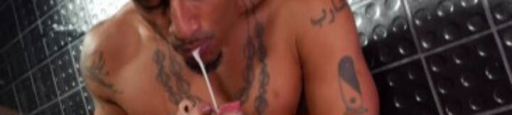 Black guy spitting in white guys mouth in consensual sexual pleasure as an act of dominance and degradation.