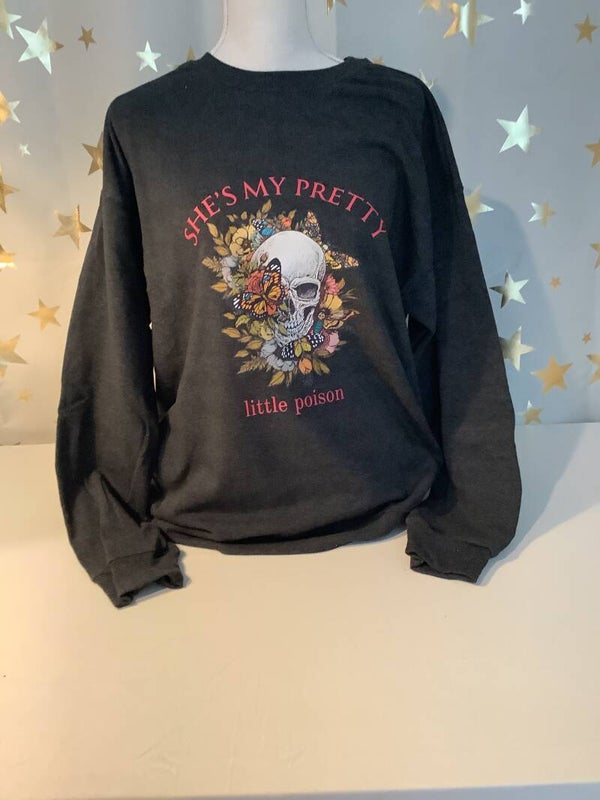 Black sweatshirt printed with “She’s My Pretty Little Poison”