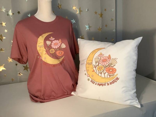 Tee-shirt printed with “Take A Moment To Breathe”