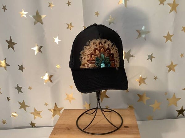 Black trucker hat with feathers and turquoise stone