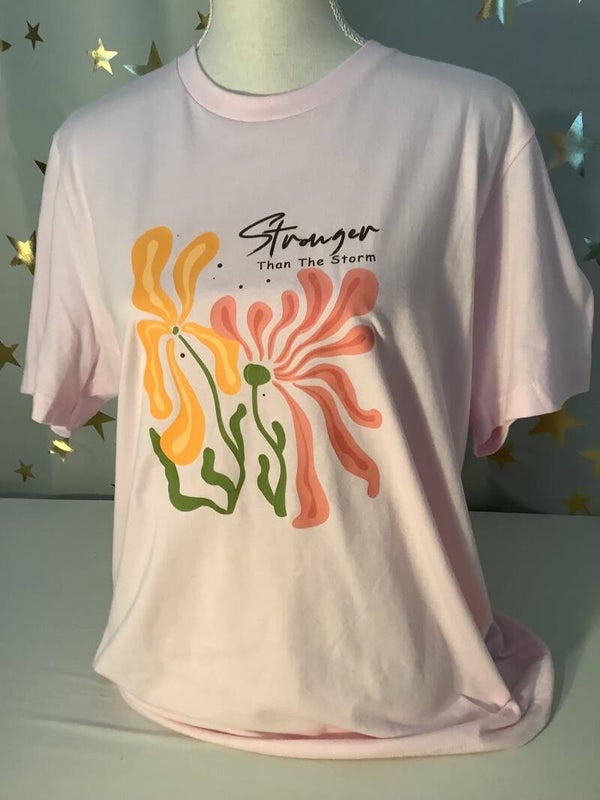 Tee-shirt printed with “Stronger Than The Storm”
