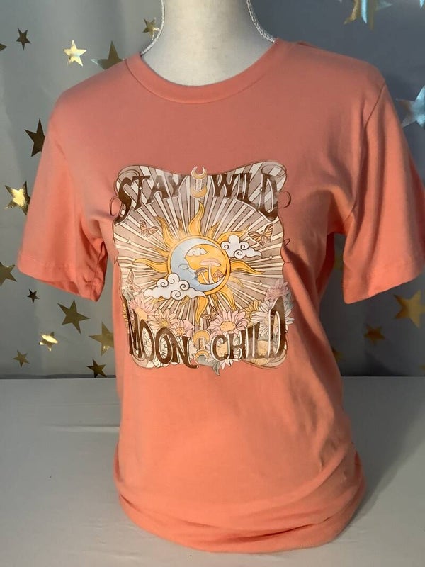 Tee-shirt printed with “Stay Wild Moon Child”