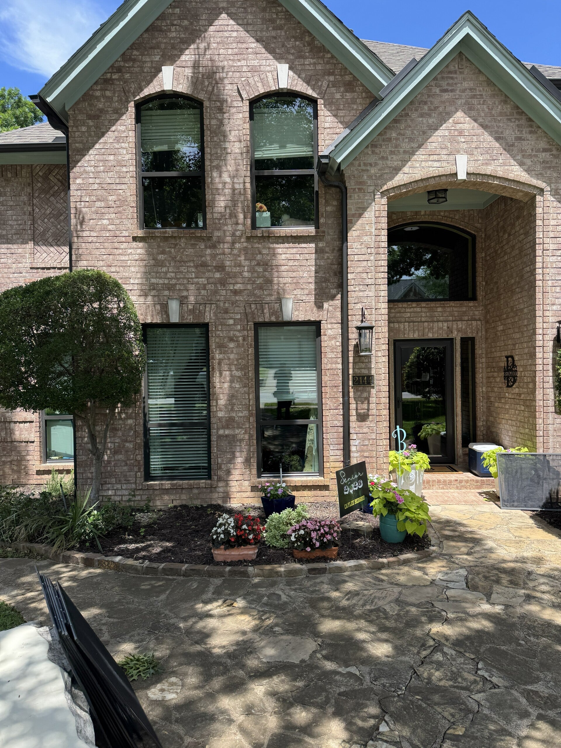 Technician performing residential window cleaning in Fort Worth, TX