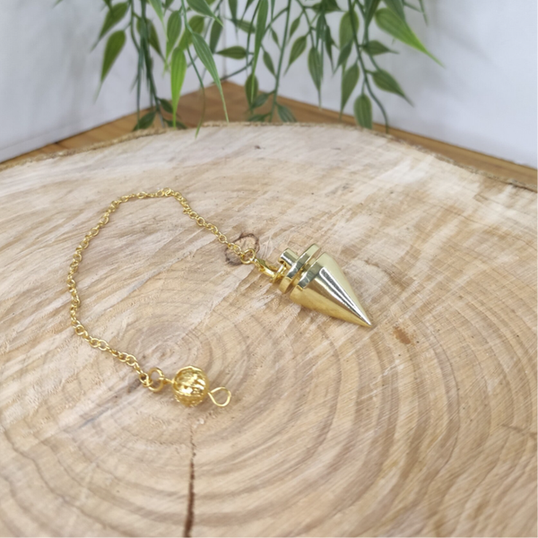 Pendule métal doré cône