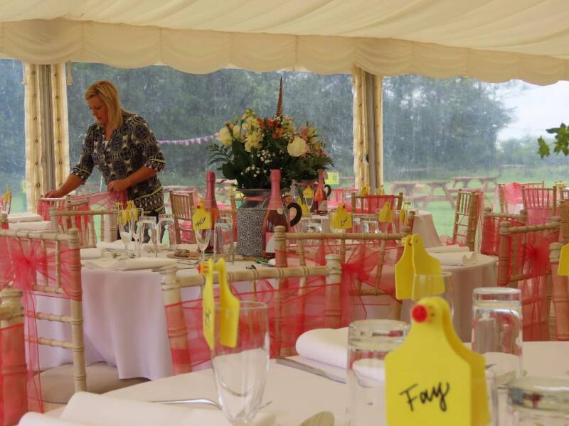 Wedding planner dressing a marquee with shades of pink