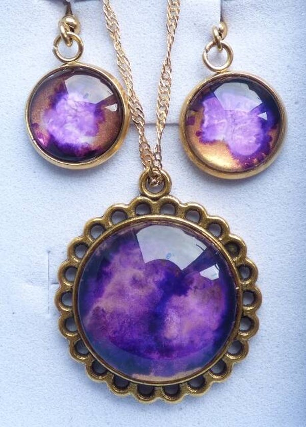Earrings with round pendants