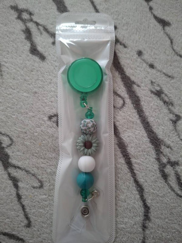 Badge met groene bloem